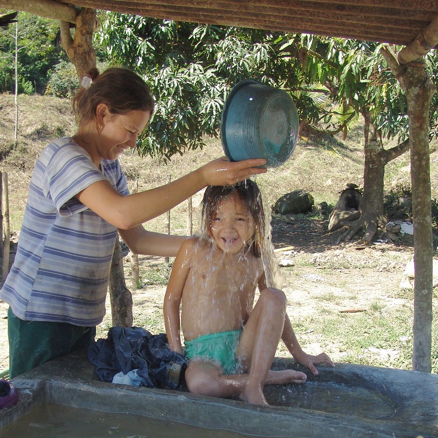 Pouring clean water over child's head