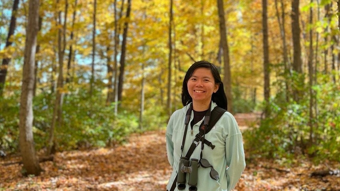 2024 Cornell Atkinson Postdoctoral Fellow Fengyi Guo doing fieldwork in Southern Indiana during fall bird migration.