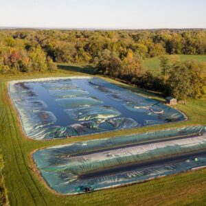 Manure piles covered to reduce methane release