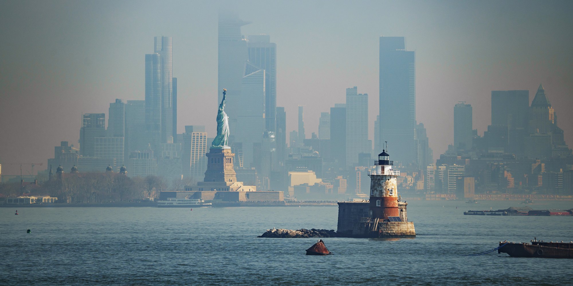 Panorama view of New York city eith statue of liberty tomorrow morning at sunrise. View from Staten Island. (iStock)