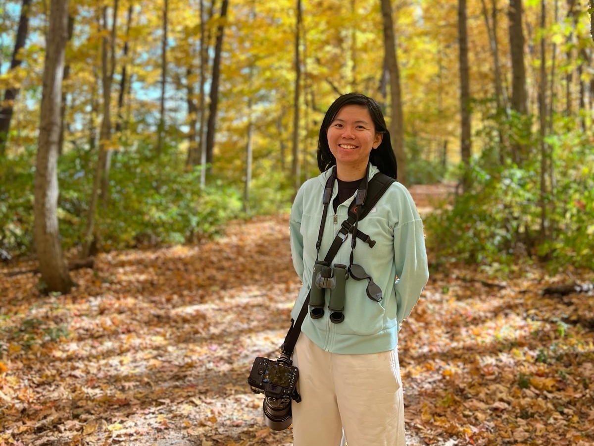 2024 Cornell Atkinson Postdoc Fengyi Guo in the woods in fall