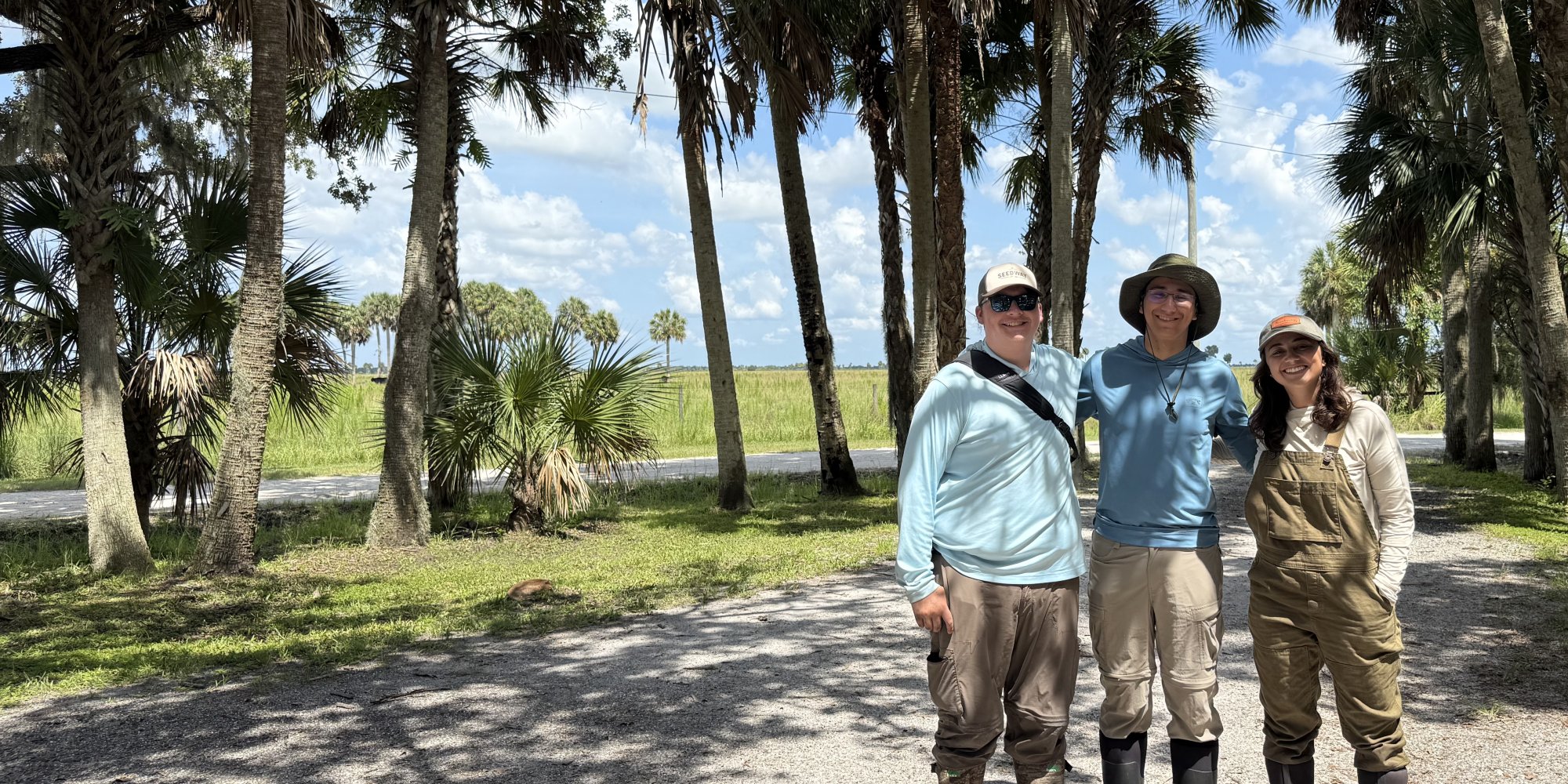 Michael Belfer ’28, Allasandra Avril Valdez, a Ph.D., Eli Barrett-Learn ’28 on ranch in Florida with Prof. Jed Sparks