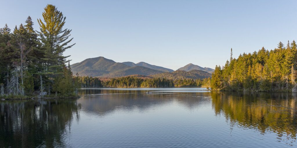 Boreas Ponds in the Adirondacks on a glassy lake with Mount Marcy and the high peaks in the background (iStock)
