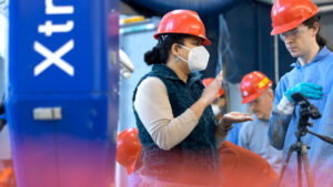 Project lead Sriramya Nair, left, assistant professor of civil and environmental engineering, and doctoral student Caleb Lunsford are part of an interdisciplinary collaboration that has developed a way to 3D-print concrete underwater.