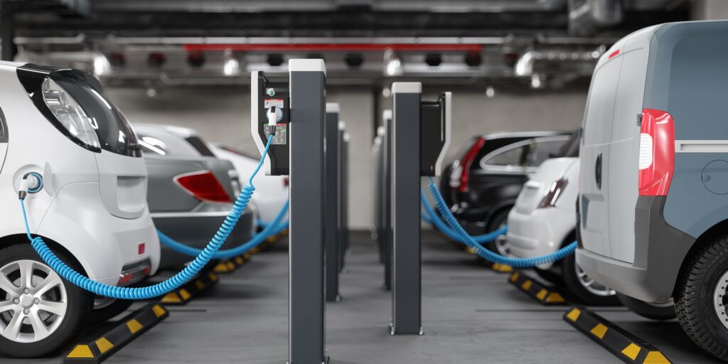 Electric cars charging in a parking garage