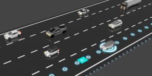 Illustration of electric car on highway with wireless charging station built into the road (iStock)